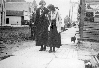 Ladies Walking on the Northwest Side of Main Street